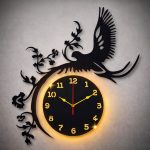 Black laminated wall clock with eagle design and soft backlight