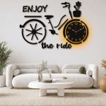 Enjoy The Ride bicycle wall clock with warm backlight detail