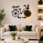 Black bicycle wall clock with 12-hour analog display