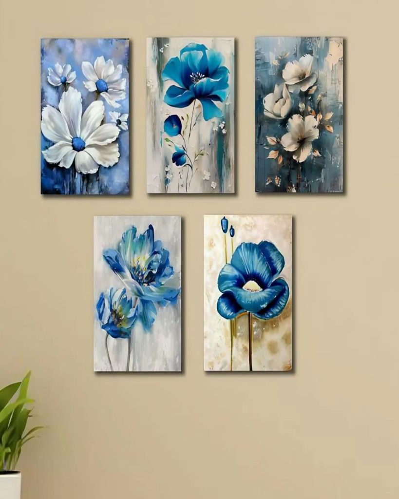 Set of 5 blue floral wall art frames arranged on wall in modern interior