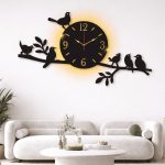 Laser-cut bird design wall clock on wall